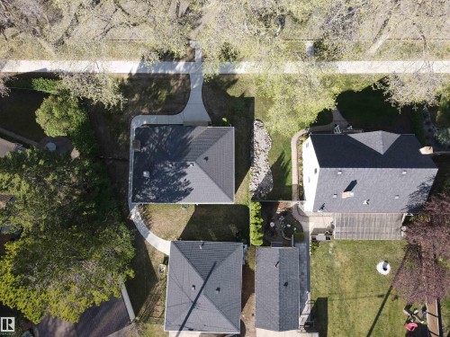 Aerial perspective showcasing multiple properties with mature tree-lined streets - 11303 60 Street, Edmonton, AB 