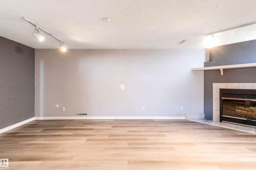 9331 52 Street, Edmonton, AB - Indoor Photo Showing Other Room With Fireplace