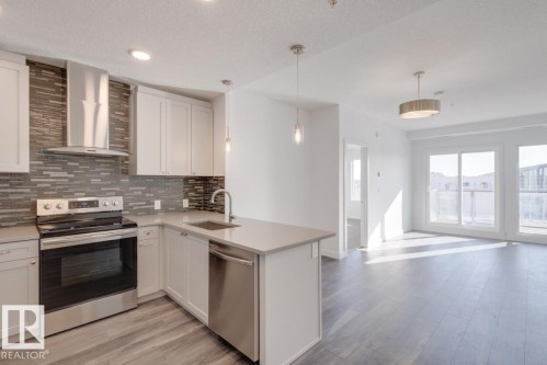 317 1316 Winderemere Way, Edmonton, AB - Indoor Photo Showing Kitchen With Upgraded Kitchen