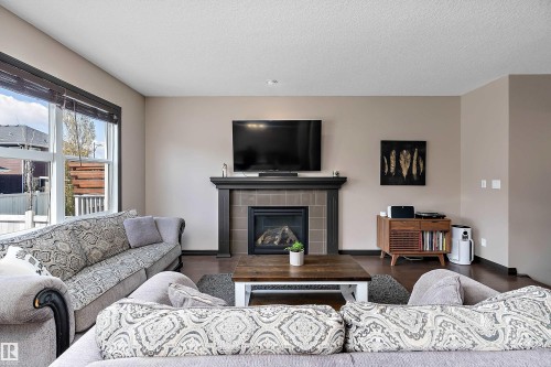268 Sheppard Circle, Leduc, AB - Indoor Photo Showing Living Room With Fireplace