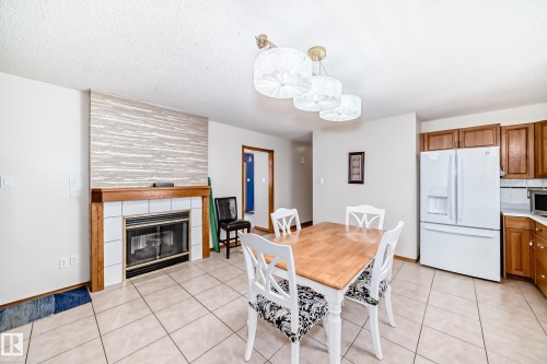 15330 99 Avenue, Edmonton, AB - Indoor Photo Showing Dining Room With Fireplace
