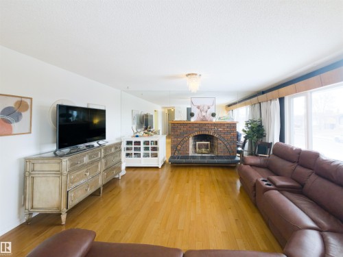 7323 147 Avenue, Edmonton, AB - Indoor Photo Showing Living Room With Fireplace
