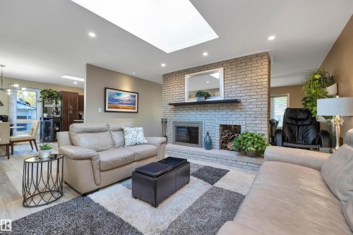 Skylights & suntunnels completed in 2018. Popcorn ceilings scraped and pots lights added throughout. 2019 - 14 Ash Place, St. Albert, AB - Indoor Photo Showing Living Room With Fireplace