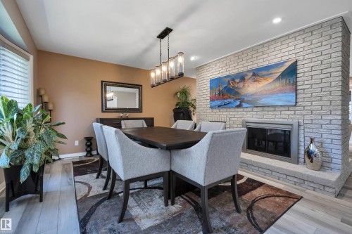 14 Ash Place, St. Albert, AB - Indoor Photo Showing Dining Room With Fireplace