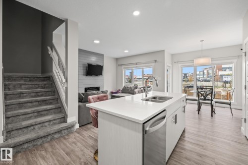 2024 160 Street Sw, Edmonton, AB - Indoor Photo Showing Kitchen With Fireplace With Double Sink