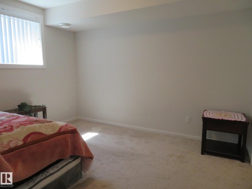 Room featuring neutral wall finishes and carpet flooring - 11840B 122 Street, Edmonton, AB - Indoor Photo Showing Bedroom