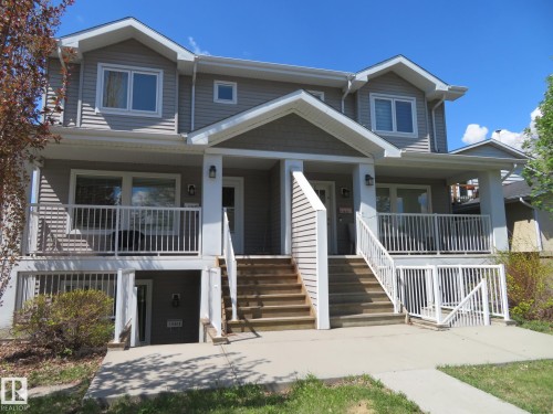 Two-story duplex featuring horizontal siding, multiple gables, and white trim - 11840B 122 Street, Edmonton, AB - Outdoor With Facade