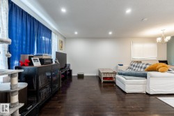 Dark wood-finish flooring extending throughout the space - 
