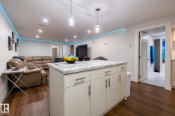 Kitchen island with stone-look countertop and under-cabinet storage - 