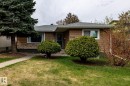 Single-story residence featuring a brown siding exterior with a stone facade accent - 3004 68 Street, Edmonton, AB  - Outdoor 