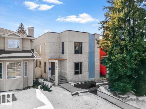 Contemporary multi-story facade featuring textured exterior finishes and contrasting vertical paneling - 8709 92A Avenue, Edmonton, AB - Outdoor With Facade