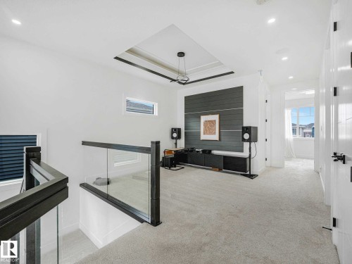 Upper-level landing featuring a contemporary recessed tray ceiling with accent lighting - 16307 19 Avenue, Edmonton, AB - Indoor Photo Showing Other Room