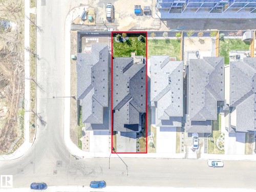 Aerial view highlighting a property with a dark shingle roof and a green lawn - 16307 19 Avenue, Edmonton, AB - Other