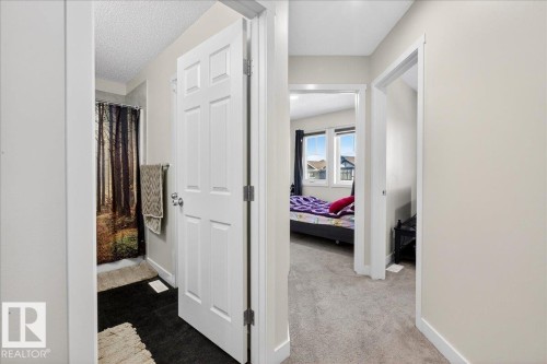 Interior hallway featuring neutral wall paint and white trim - 5315 22 Avenue, Edmonton, AB - Indoor