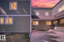 Multi-unit property exterior featuring horizontal siding and white trim - 32 1820 56 Street, Edmonton, AB  - Outdoor With Exterior 