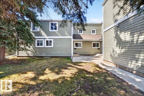 Green siding exterior with white window trim - 32 1820 56 Street, Edmonton, AB - Outdoor
