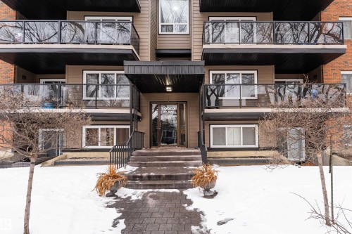 The property features a multi-level exterior with balconies and a welcoming entrance - 203 10003 87 Avenue, Edmonton, AB - Outdoor With Facade