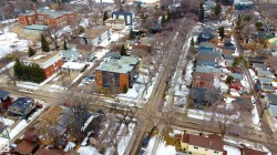 Aerial view showcasing a residential area with varied property types, including multi-story buildings and houses - 