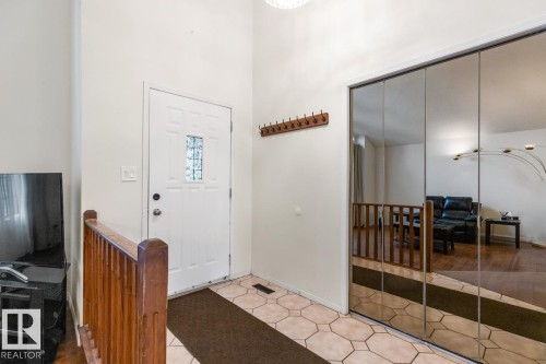 Entryway featuring geometric tile flooring and a white front door with decorative glass inserts - 4340 33 Street, Edmonton, AB - Indoor Photo Showing Other Room