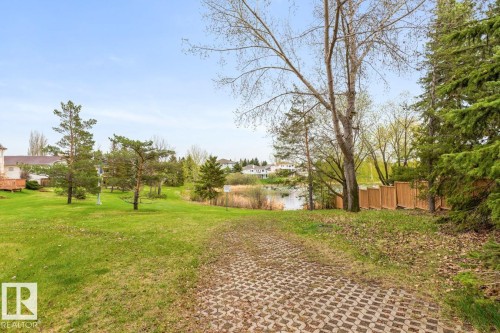 Expansive green space featuring a permeable paver pathway - 4340 33 Street, Edmonton, AB - Outdoor