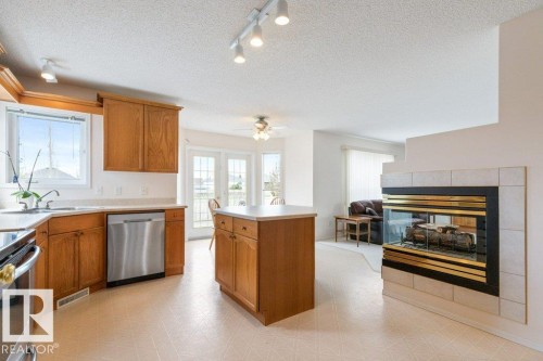 1346 118A Street, Edmonton, AB - Indoor Photo Showing Kitchen With Fireplace
