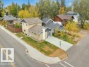 Two-story residence with light-toned siding, dark roof, and white trim - 3602 50Th Ave, Sylvan Lake, AB  - Outdoor 