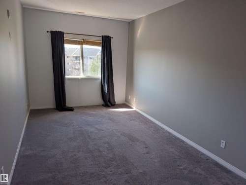 Very spacious master bedroom featuring abundant natural light, ample closet space, and a relaxing atmosphere. - 419 4304 139 Avenue, Edmonton, AB - Indoor