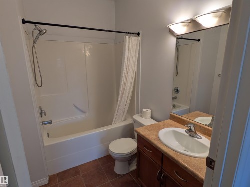Spacious 4-piece ensuite bath designed for comfort with a tub/shower combination and ample counter space. - 419 4304 139 Avenue, Edmonton, AB - Indoor Photo Showing Bathroom