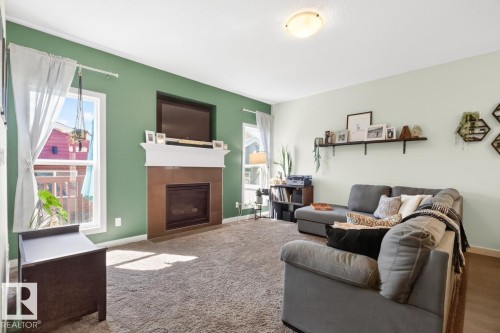 418 Simmonds Way, Leduc, AB - Indoor Photo Showing Living Room With Fireplace