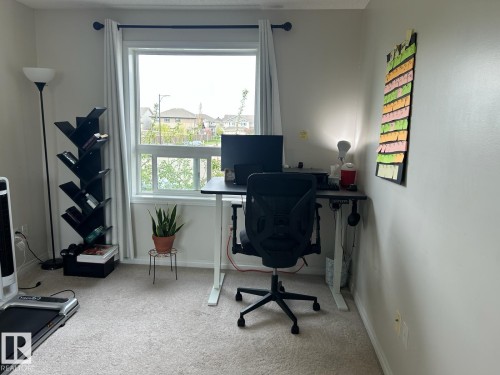 Neutral wall color with a light carpeted floor - 1228 9363 Simpson Drive, Edmonton, AB - Indoor Photo Showing Office