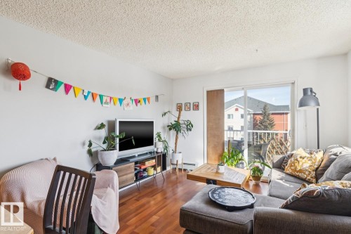 419 10535 122 Street, Edmonton, AB - Indoor Photo Showing Living Room