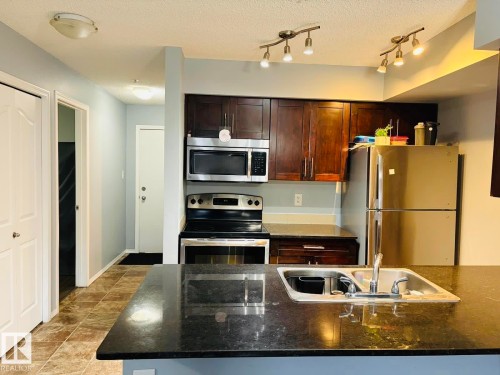 122 270 Mcconachie Drive, Edmonton, AB - Indoor Photo Showing Kitchen With Stainless Steel Kitchen With Double Sink