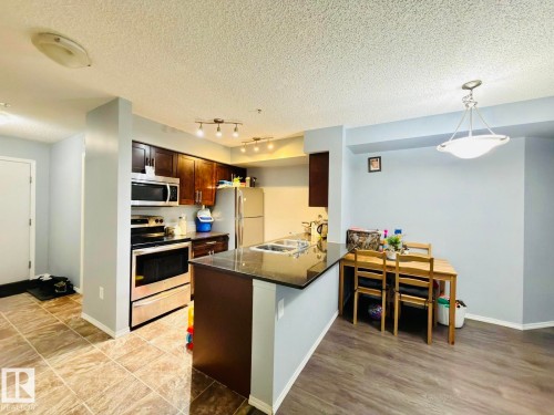 122 270 Mcconachie Drive, Edmonton, AB - Indoor Photo Showing Kitchen With Stainless Steel Kitchen With Double Sink