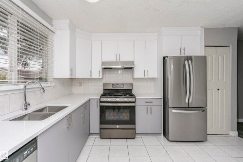 Spacious country kitchen with large dinette area & st/steel appliances. - 11436 161 Avenue, Edmonton, AB - Indoor Photo Showing Kitchen With Double Sink