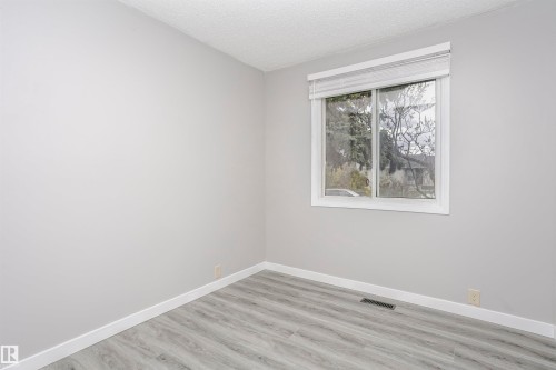 Bedroom 2 on main floor with vinly plank flooring. - 11436 161 Avenue, Edmonton, AB - Indoor Photo Showing Other Room