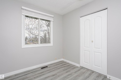 Bedroom 2 on main floor with vinly plank flooring. - 11436 161 Avenue, Edmonton, AB - Indoor Photo Showing Other Room