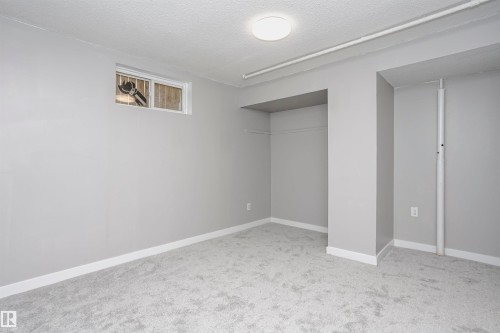 Bedroom 4 in basement with new plush carpet and closet areas. - 11436 161 Avenue, Edmonton, AB - Indoor Photo Showing Other Room