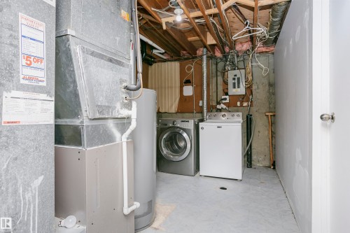 Newer high efficiency furnace and new hot water tank.  Hot water tank installed in January 2025. - 11436 161 Avenue, Edmonton, AB - Indoor Photo Showing Laundry Room