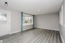 Bay window in living room. Beautiful new vinyl plank flooring in front entry and throughout main floor.  Tile in kitchen and bathrooms. Freshly painted throughout and new lighting. - 11436 161 Avenue, Edmonton, AB  - Indoor Photo Showing Other Room 