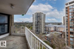 Private balcony featuring a concrete floor and white metal railing - 
