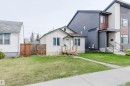 Cozy single-story residence featuring a front lawn and a wooden privacy fence - 10834 75 Avenue, Edmonton, AB  - Outdoor 