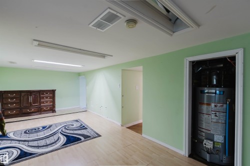 Light green walls with wood-finish flooring - 10834 75 Avenue, Edmonton, AB - Indoor