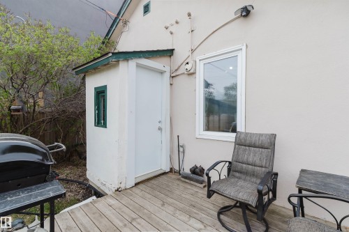 Wood-finish deck with a stucco exterior - 10834 75 Avenue, Edmonton, AB - Outdoor With Exterior