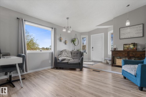 Bright interior space featuring light wood-finish flooring and neutral wall tones - 4759 48 Street, Onoway, AB - Indoor Photo Showing Living Room