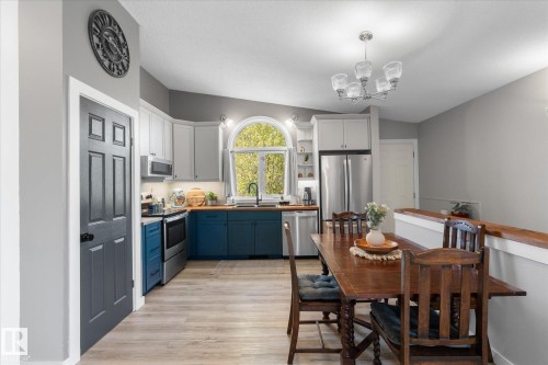 Kitchen and dining area featuring light wood-finish flooring - 4759 48 Street, Onoway, AB - Indoor