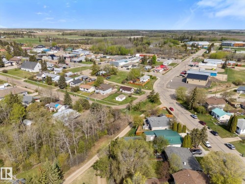 Aerial perspective showcasing residential properties and commercial structures - 4759 48 Street, Onoway, AB - Outdoor With View