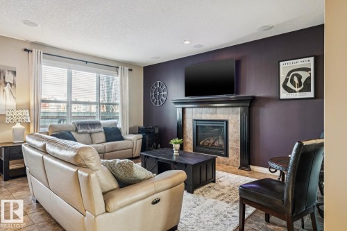3673 Atkinson Loop, Edmonton, AB - Indoor Photo Showing Living Room With Fireplace