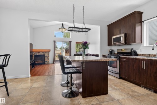 9014 166 Avenue, Edmonton, AB - Indoor Photo Showing Kitchen With Fireplace