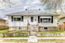 Siding exterior with a gabled roof and decorative window awnings - 4006 115 Avenue, Edmonton, AB 