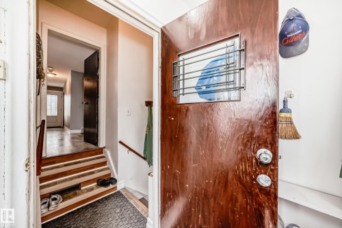 Hardwood door with security grate window - 4006 115 Avenue, Edmonton, AB 